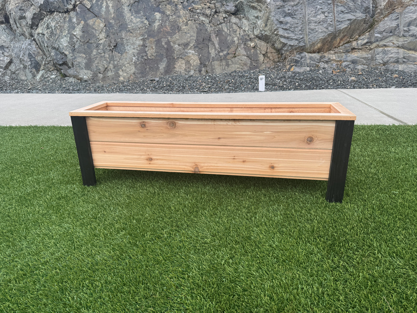 1248Blk - 48"L x 12"W x 15"H Red Cedar Flower Planter with Black Cedar Legs